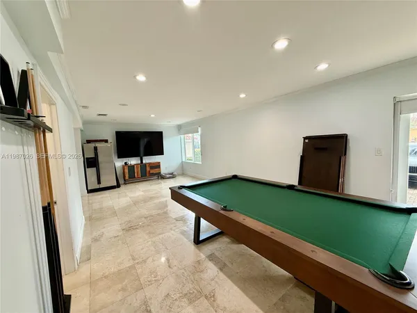 a room with furniture and a flat screen tv