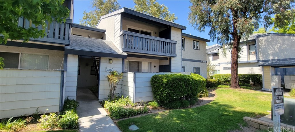 27662 Haskell Canyon Road, Unit D Saugus, CA 91350 - Photo 1 of 1 a front view of a house with a yard