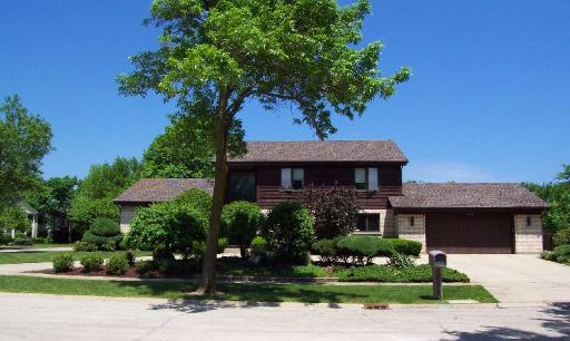3350 Old Mill Road Northbrook, IL 60062 - Photo 1 of 1 a front view of a house with a garden