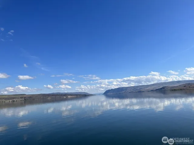 a dining room with furniture window and wooden floor