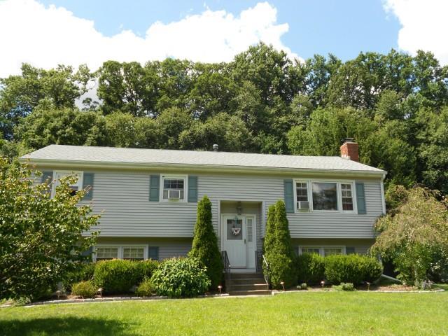 18 Caye Road Danbury, CT 06811 - Photo 1 of 1 a front view of a house with a yard