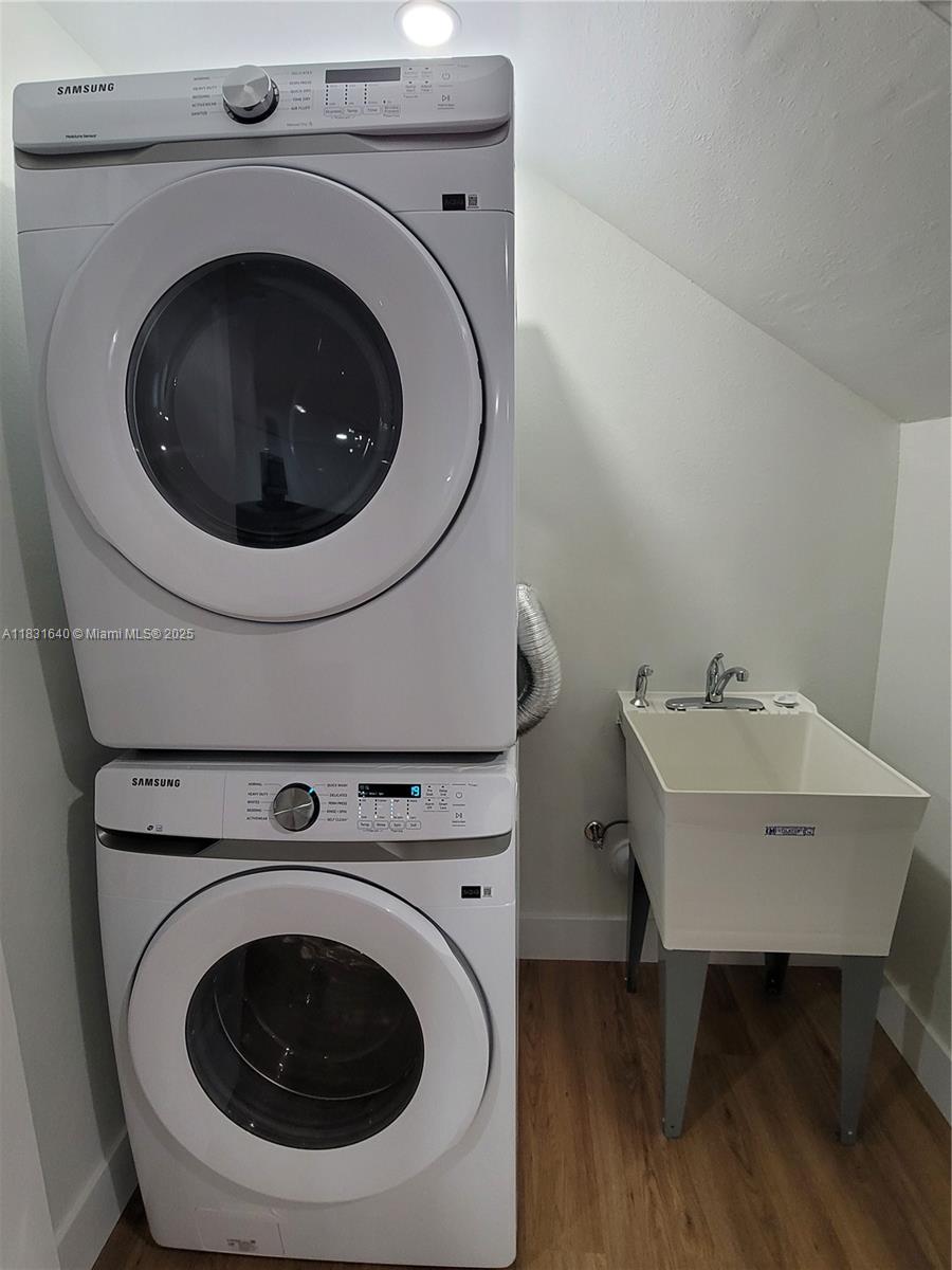 16955 Southwest 100th Avenue Miami, FL 33157 - Photo 21 of 42 a utility room with sink dryer and washer