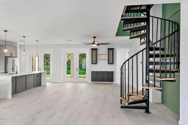 a kitchen with granite countertop a stove and a refrigerator