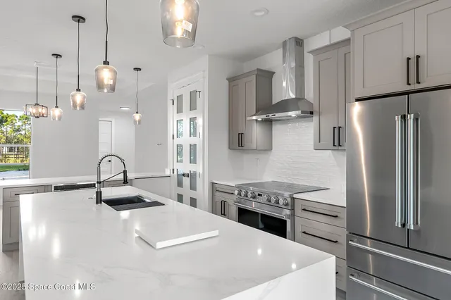 a view of a bathroom with a shower and a sink