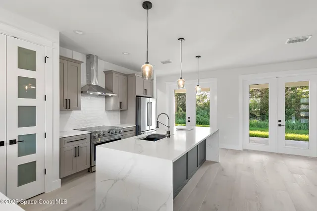 a bathroom with a sink double vanity and a shower