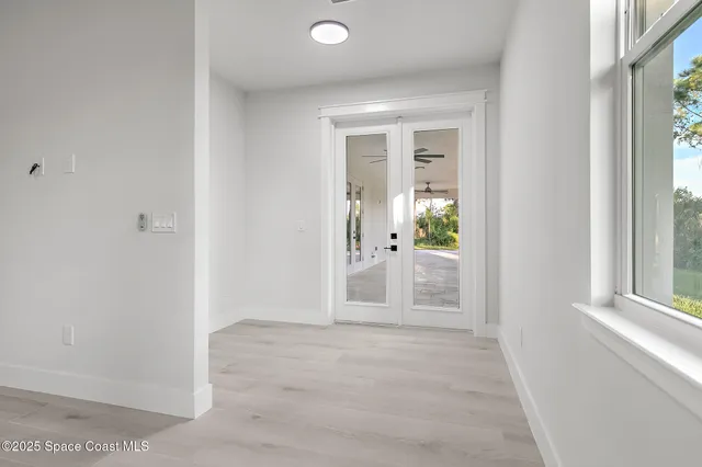 a kitchen with a sink and refrigerator