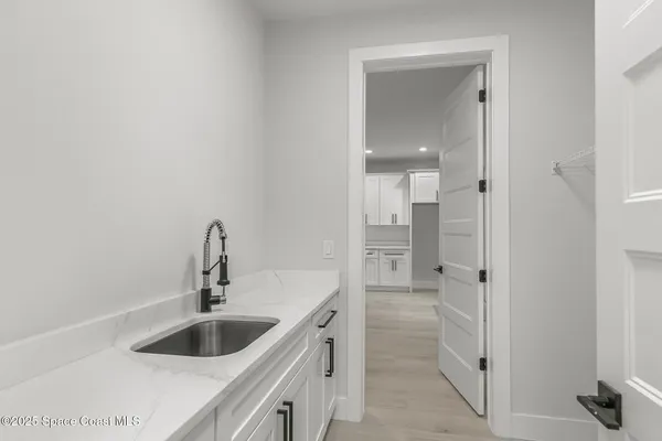 an empty room with wooden floor and window
