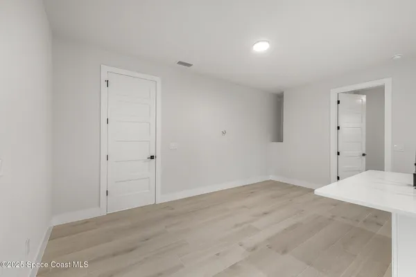 front view of a house with a small yard