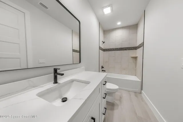 a house that has a yard and a garage