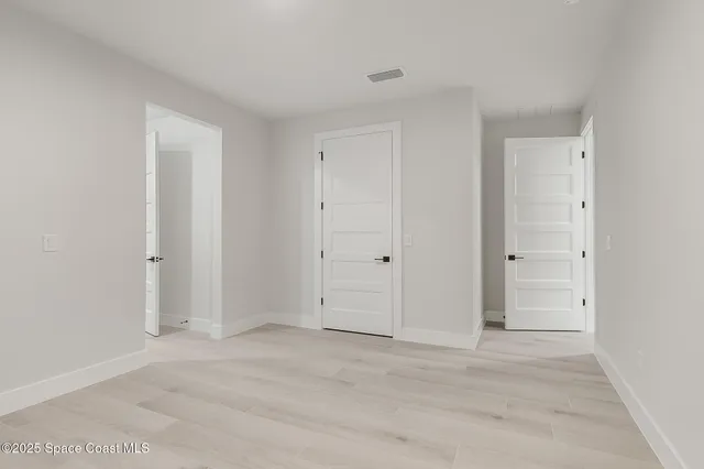 a view of a house with a yard and tree s