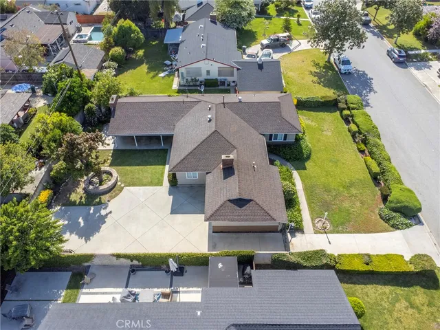 an aerial view of a house with swimming pool