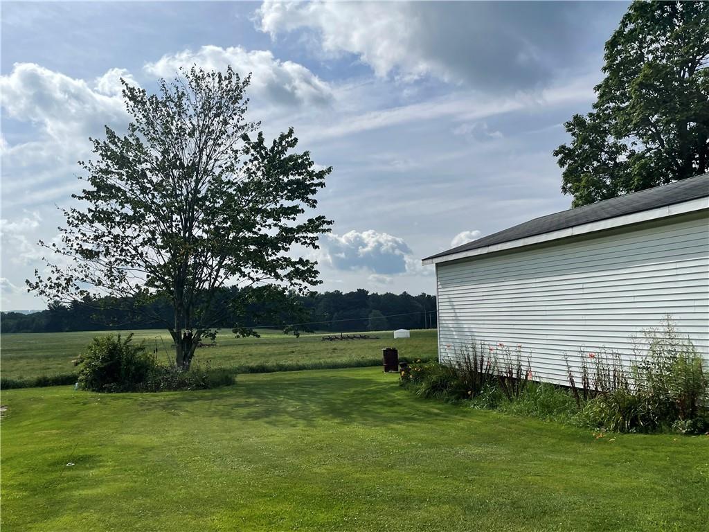 3386 Cookport Road Commodore, PA 15729 - Photo 6 of 24 a backyard of a house with lots of green space table and chairs