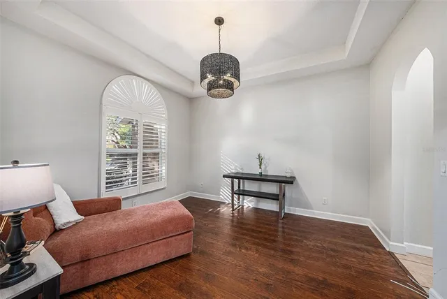 a bedroom with furniture and a window
