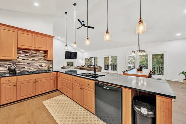a bedroom with two beds and a chandelier