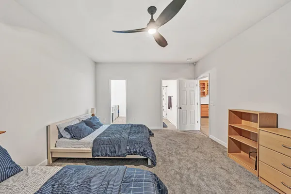a bedroom with a bed and a fireplace