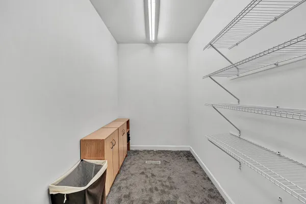 a bathroom with a double vanity sink mirror and