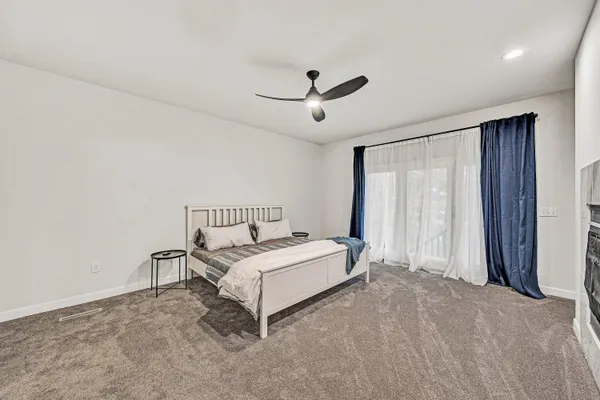 a bathroom with a shower curtain and a sink