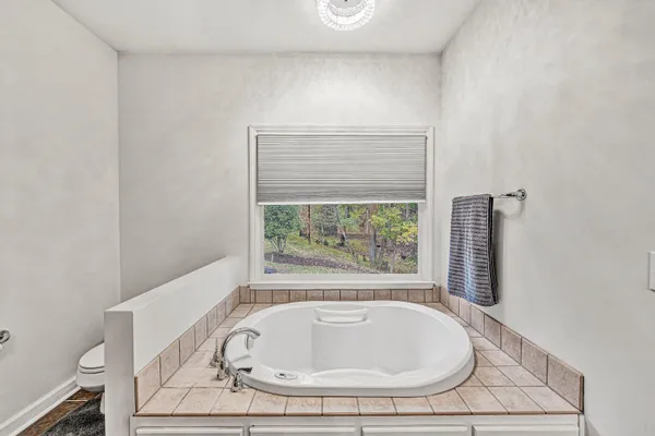 a view of balcony with furniture and wooden deck