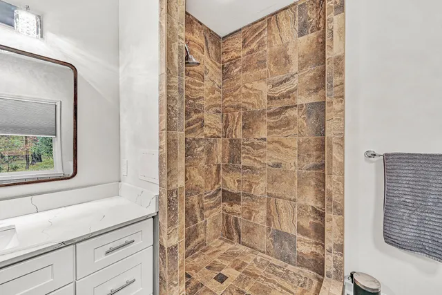 a view of balcony with wooden floor and outdoor seating