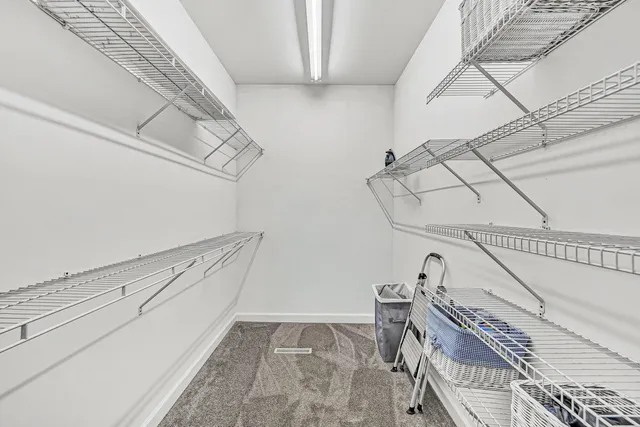 a utility room with cabinets washer and dryer