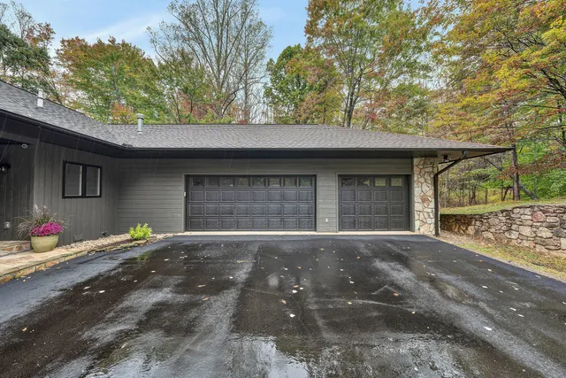 a living room with a table chairs and a flat screen tv