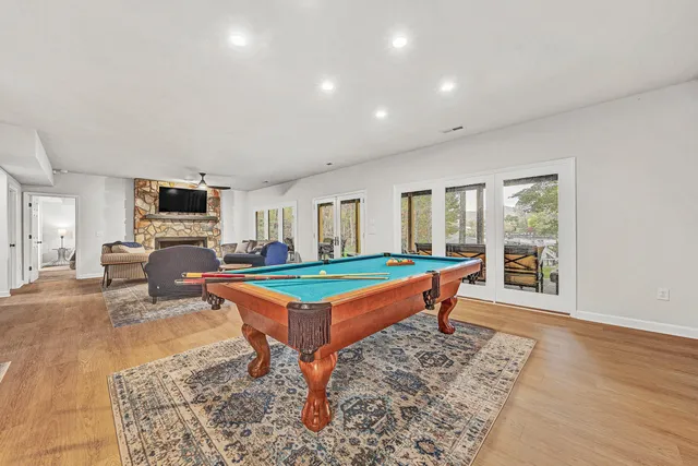 a bedroom with a bed and a large mirror