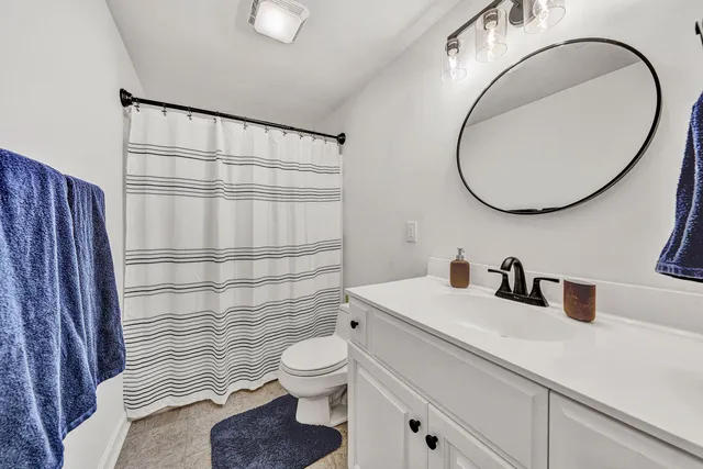a view of a house with backyard porch and sitting area