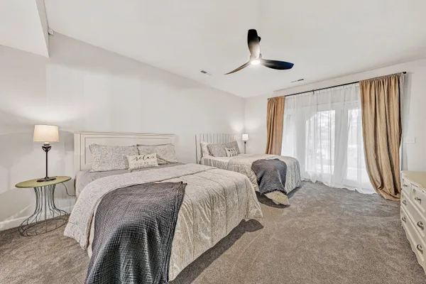 a view of a house with backyard porch and sitting area