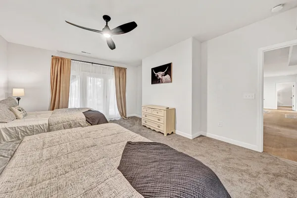 a view of a patio with table and chairs under an umbrella