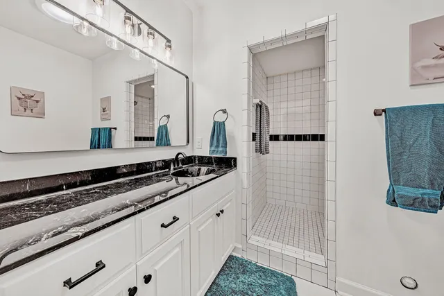 a view of a chair and tables in the patio