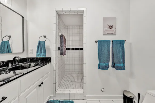 a view of a chair and tables in the patio