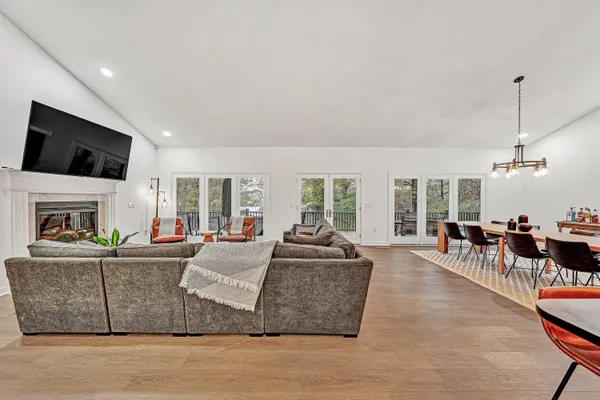a living room with fireplace furniture and a flat screen tv