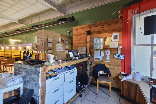 a stove top oven sitting inside of a kitchen