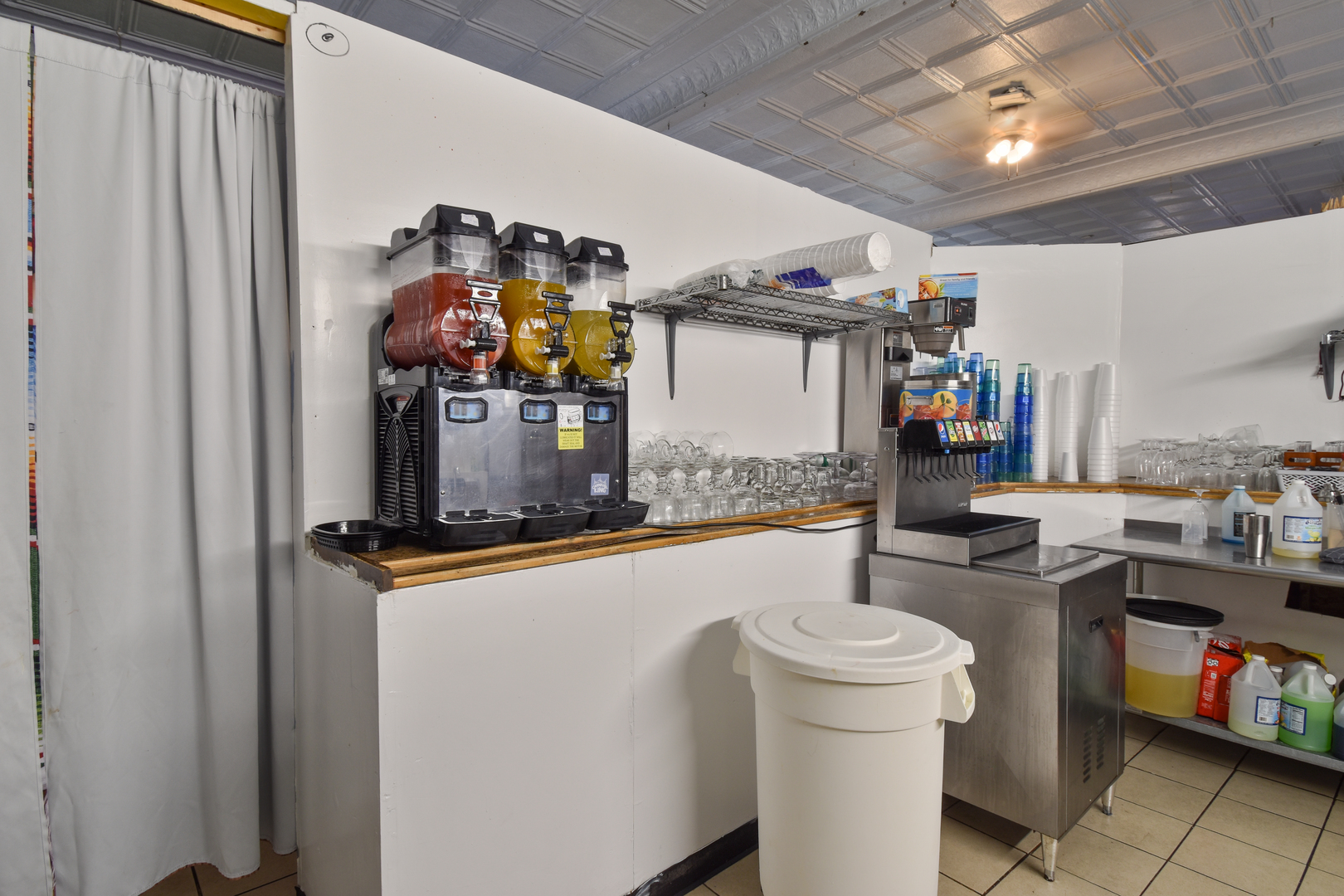 118 East Main Street Dwight, IL 60420 - Photo 17 of 77 a kitchen with lots of clutter and stainless steel appliances
