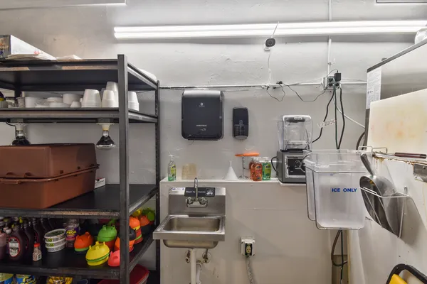 a bathroom with a sink toilet and mirror