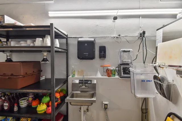 a bathroom with a sink toilet and mirror