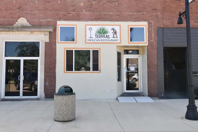 a view of a building with a door and windows
