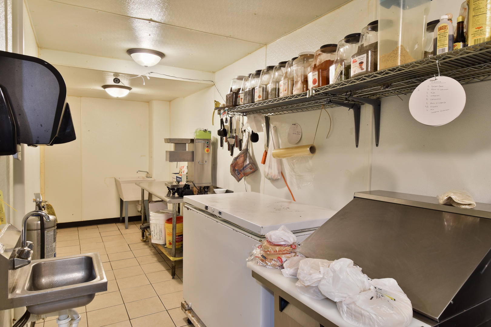 118 East Main Street Dwight, IL 60420 - Photo 29 of 77 a kitchen with a sink a stove and chairs