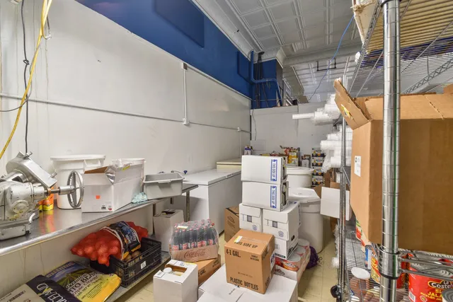 a kitchen with a refrigerator stove and sink