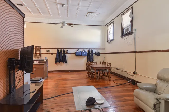 a view of a porch with a wooden door and a porch
