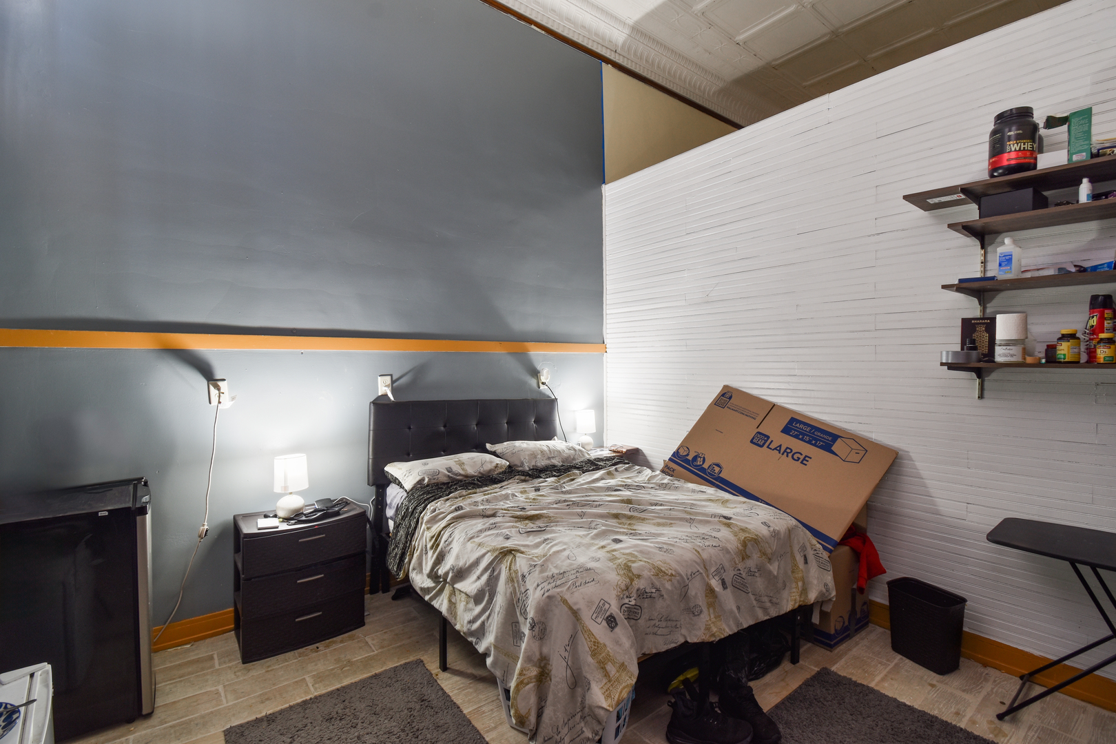 118 East Main Street Dwight, IL 60420 - Photo 59 of 77 a bed sitting in a bedroom next to a lamp with kitchen view