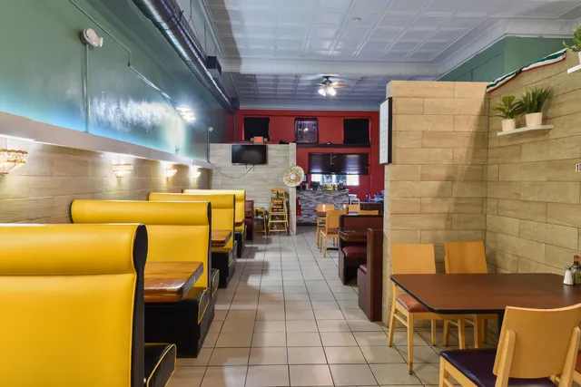 a view of a dining room with furniture