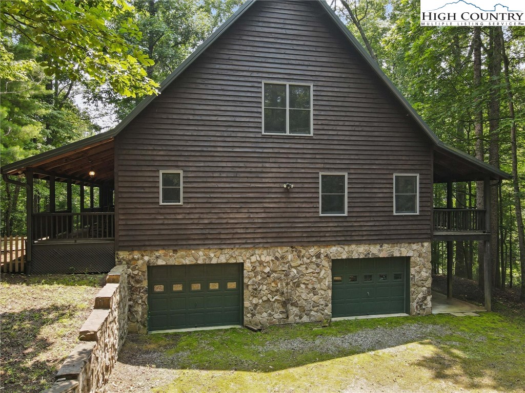 208 Hawkbill Road Ferguson, NC 28624 - Photo 35 of 36 a front view of a house with a yard