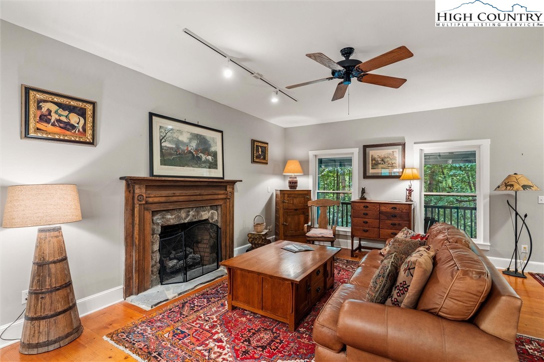 208 Hawkbill Road Ferguson, NC 28624 - Photo 6 of 36 a living room with furniture and a fireplace