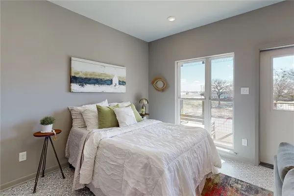 a bedroom with a bed and a table