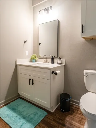 a bathroom with a shower toilet and sink