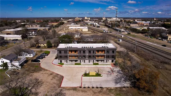 an aerial view of a house with a garden