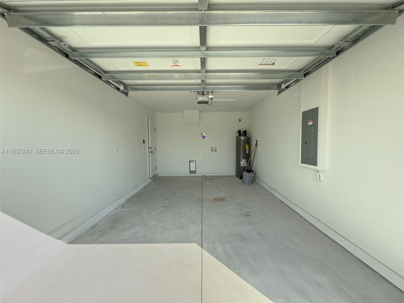 842-844 Alabama Road South Lehigh Acres, FL 33974 - Photo 16 of 40 a view of a room with a ceiling fan
