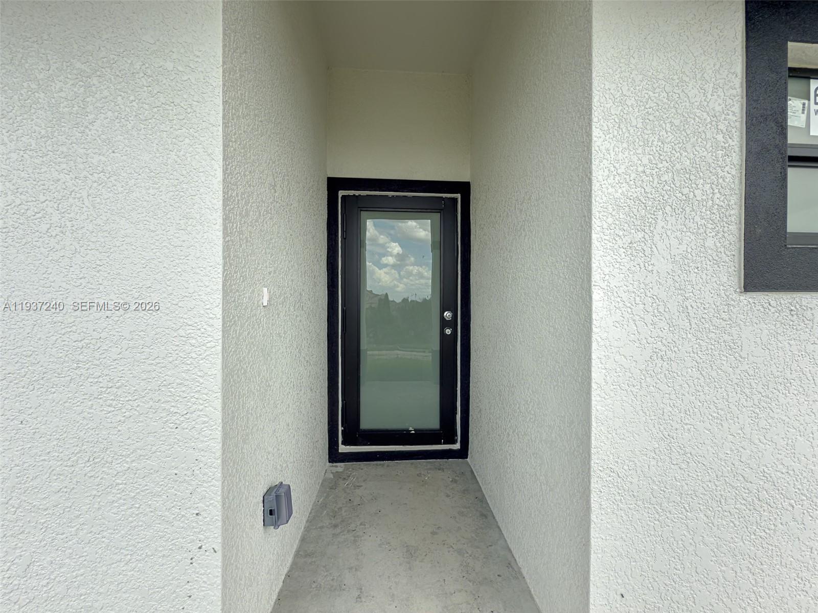842-844 Alabama Road South Lehigh Acres, FL 33974 - Photo 17 of 40 a view of a hallway with wooden floor