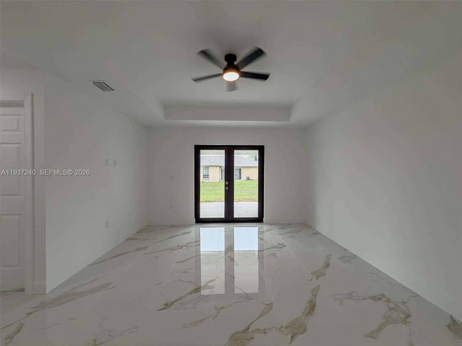 842-844 Alabama Road South Lehigh Acres, FL 33974 - Photo 20 of 40 a view of an empty room with a window